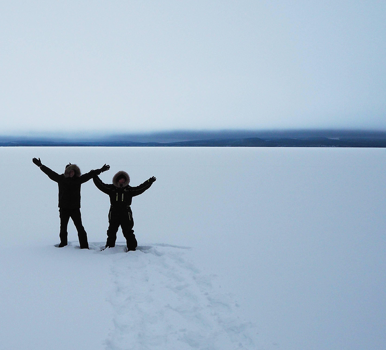 Snowshoe experience with traditional beverages in Lapland
