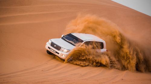 Dubai Desert Dune Bashing 1-day Tour: Camel Riding + Transfer + Sunset · Dinner/Show/Henna Painting Day Tours