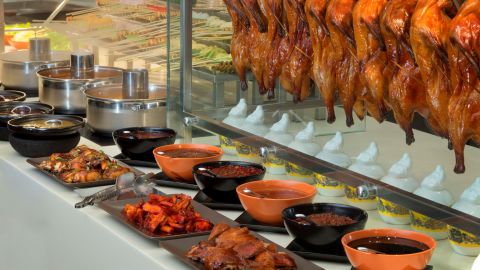 Plated dishes and serving trays at the Saffron dinner buffet