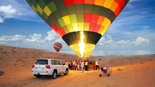 Dubai desert hot air balloon ride: Enjoy desert sunrise/falcon show/flight certificate/camel ride + coffee Day Tours