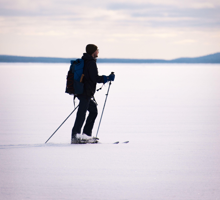 Skiing in Riisitunturi NP at Night & Wilderness Dinner
