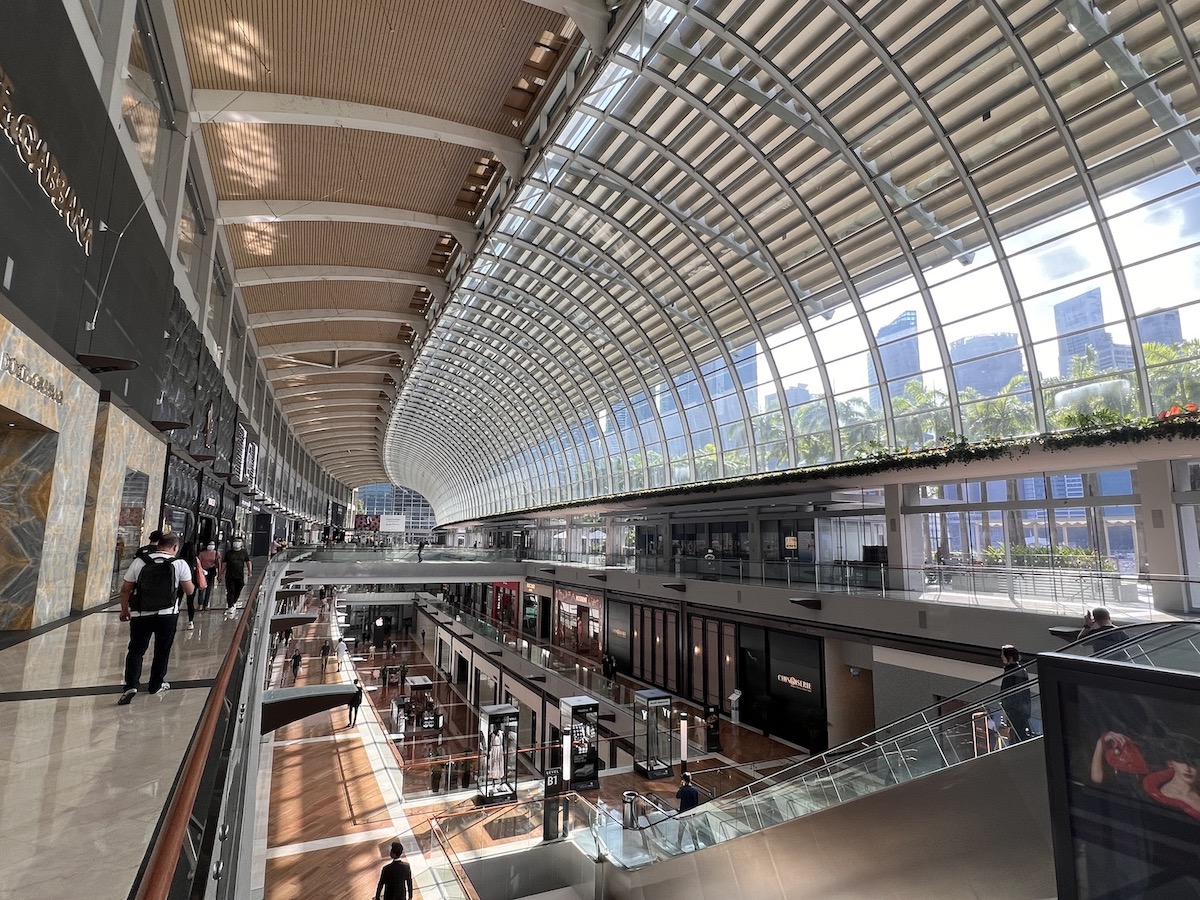 Arched glass roof and shopping levels inside The Shoppes at Marina Bay Sands