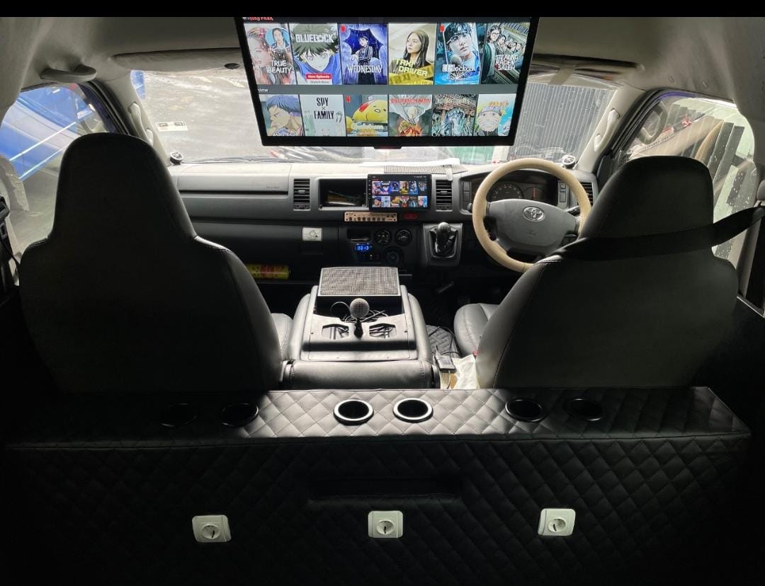 Air-conditioned private car with driver waiting to collect travellers