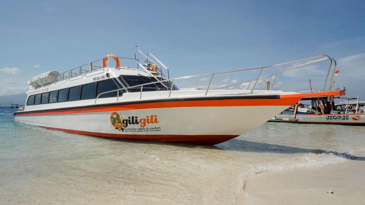 Passengers boarding a fast boat at Padang Bai harbour bound for the Gili Islands