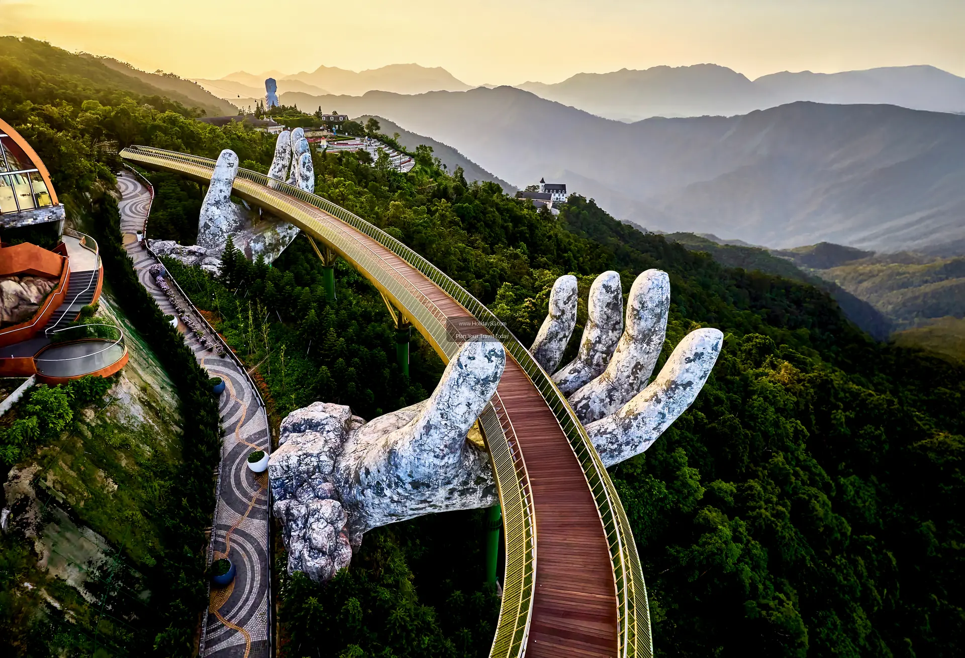 The Golden Bridge supported by giant stone hands at Ba Na Hills near Da Nang